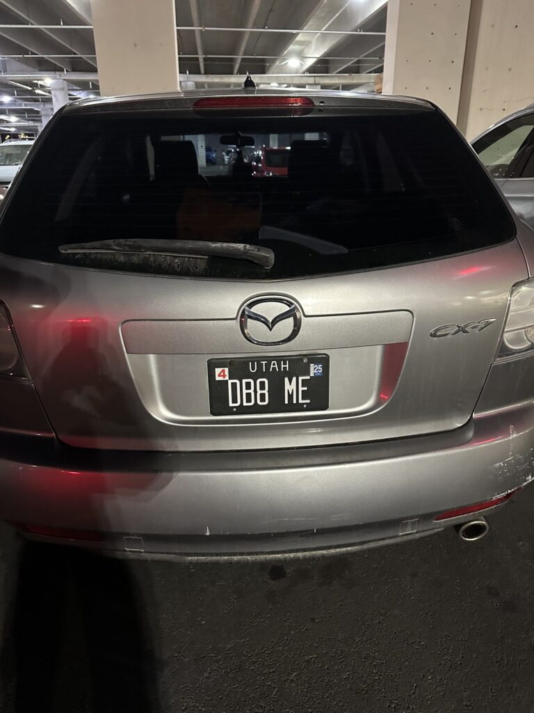 car with a Utah license plate that says DB8 ME