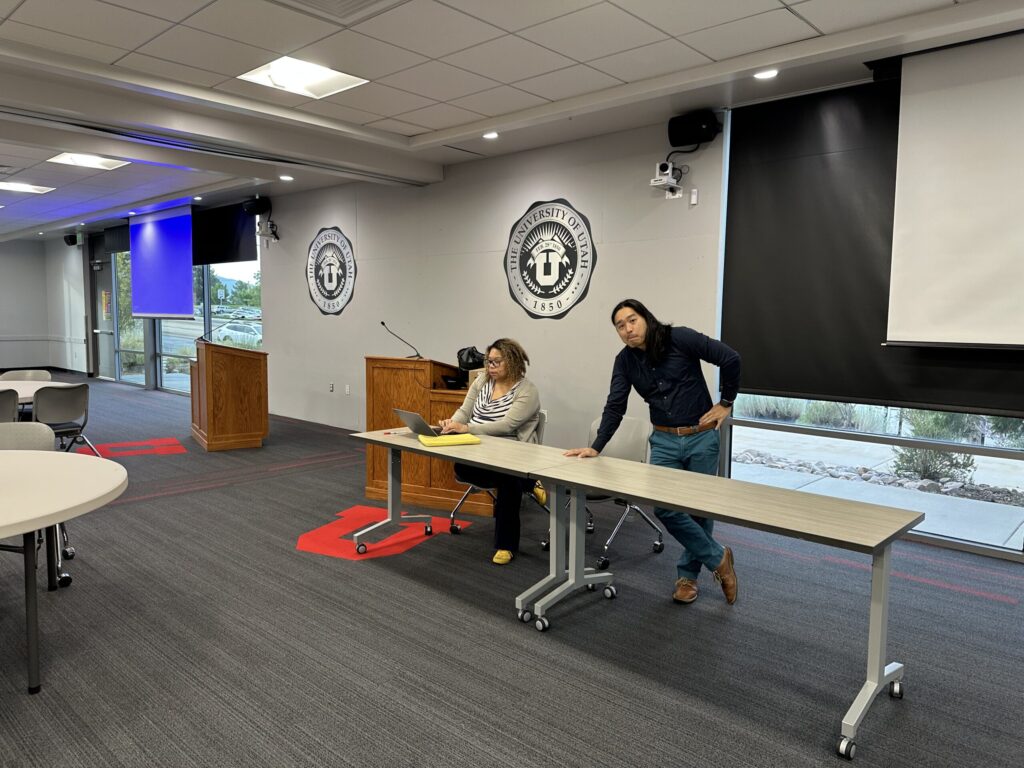 two scholars setting up for a conference
